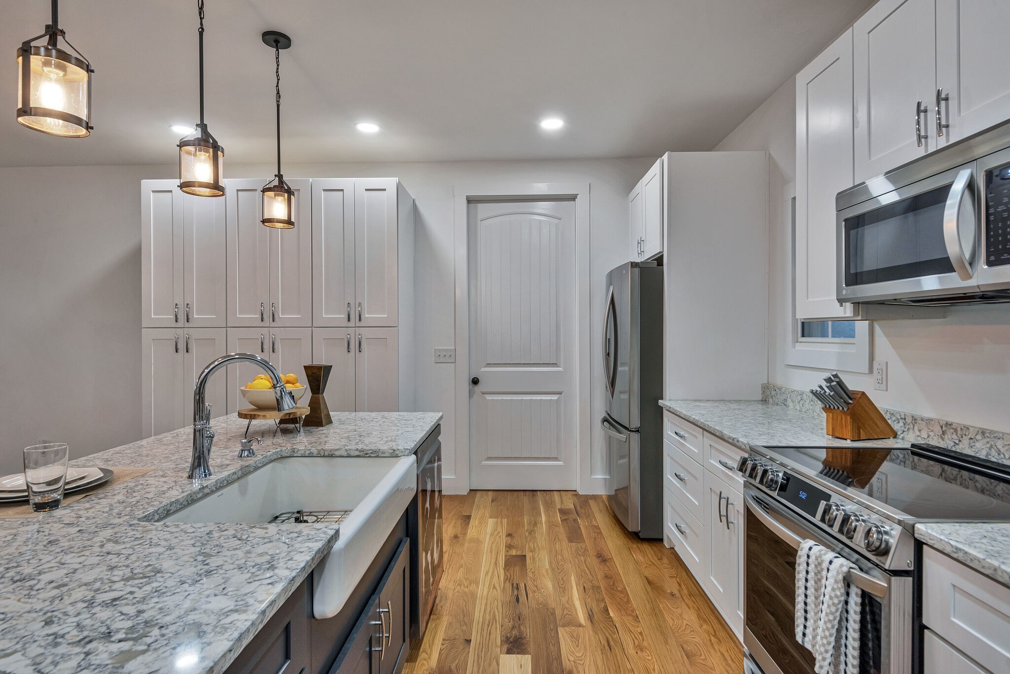 418 Lyle Lane Dickson, TN 37055 - Photo 21 of 51 a kitchen with a refrigerator a sink and wooden cabinets
