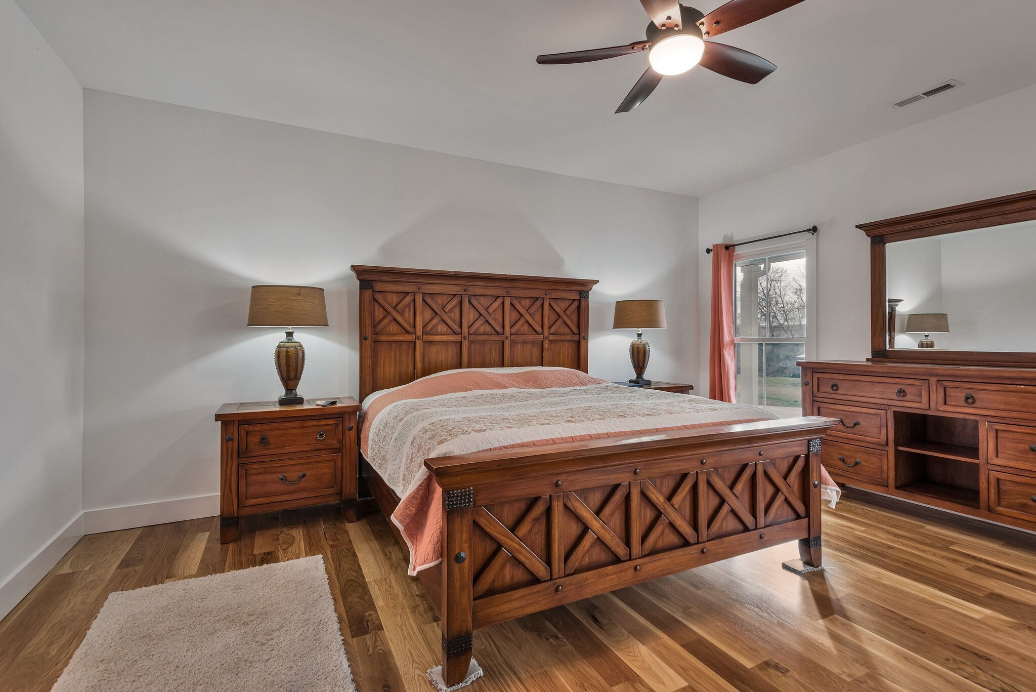 418 Lyle Lane Dickson, TN 37055 - Photo 36 of 51 a bedroom with a bed and wooden floor
