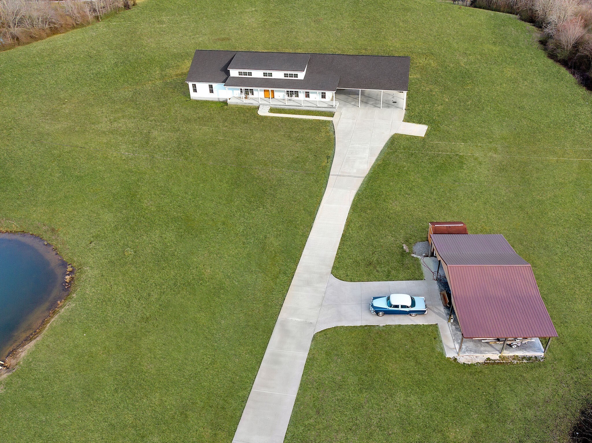 418 Lyle Lane Dickson, TN 37055 - Photo 4 of 51 an aerial view of a house with a garden