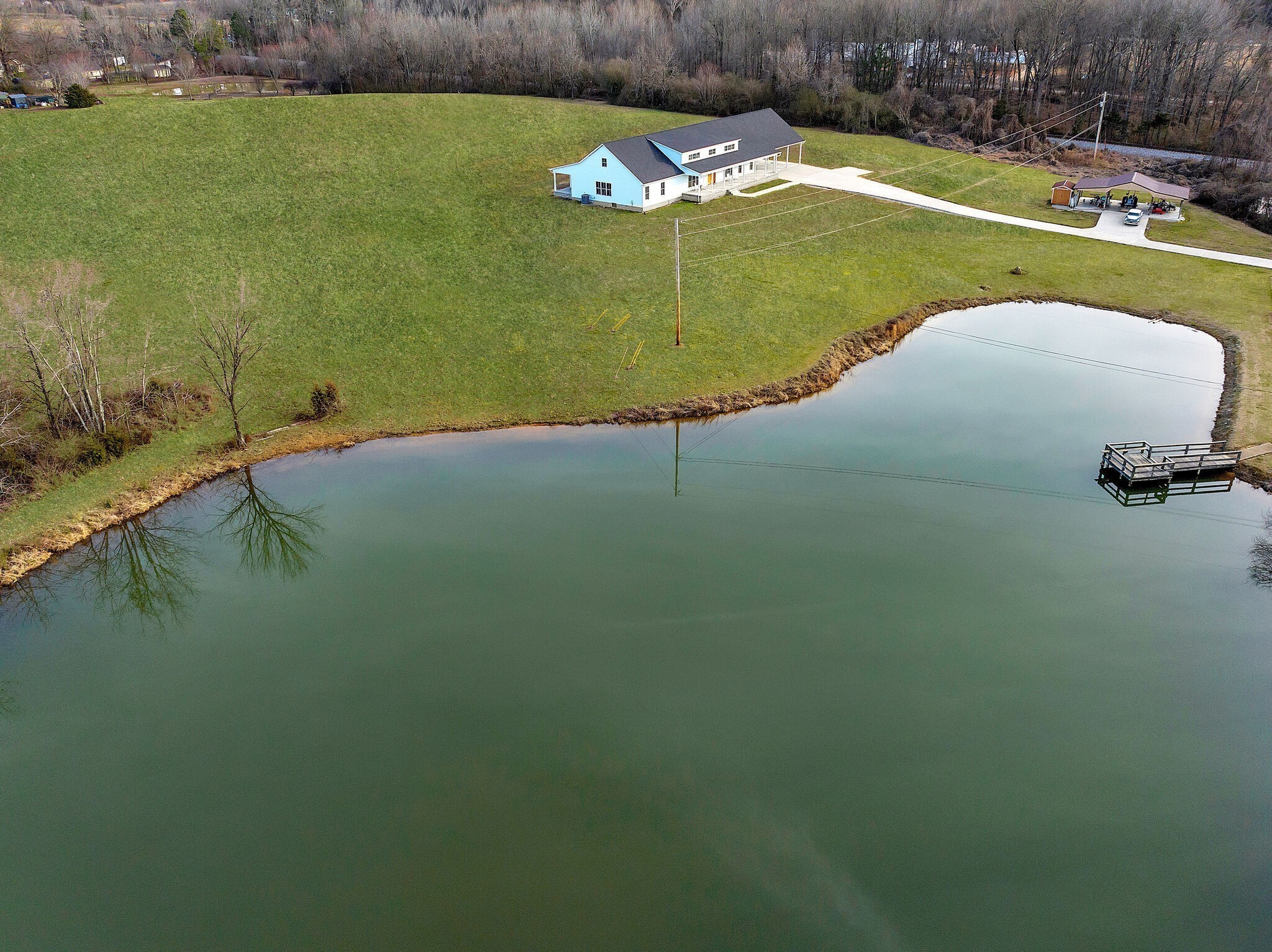 418 Lyle Lane Dickson, TN 37055 - Photo 44 of 51 a view of a lake with a yard