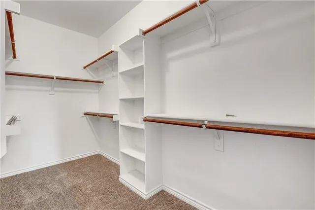a view of an empty walk in closet
