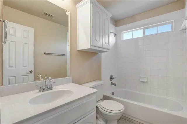 a bathroom with a sink a toilet and a bathtub