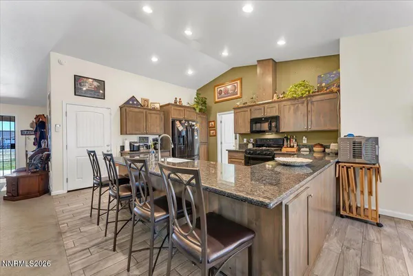 a living room with furniture and potted plant