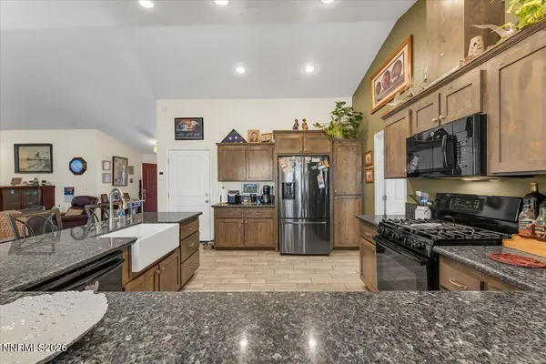 a bedroom with furniture and a flat screen tv