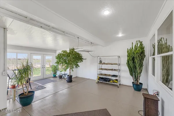 a view of balcony with couch and chairs