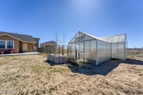 a view of a house with a yard and garage