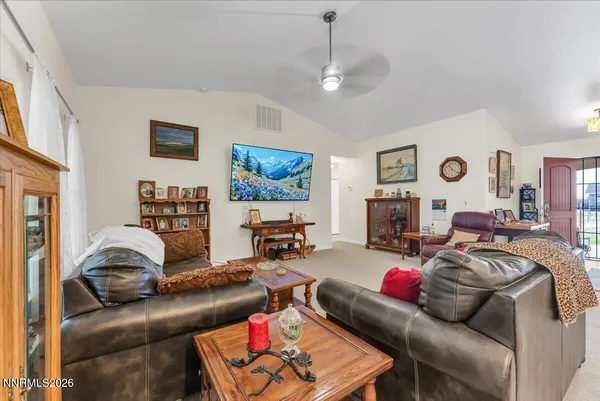 a kitchen with stainless steel appliances granite countertop a stove a sink a refrigerator and a cabinets