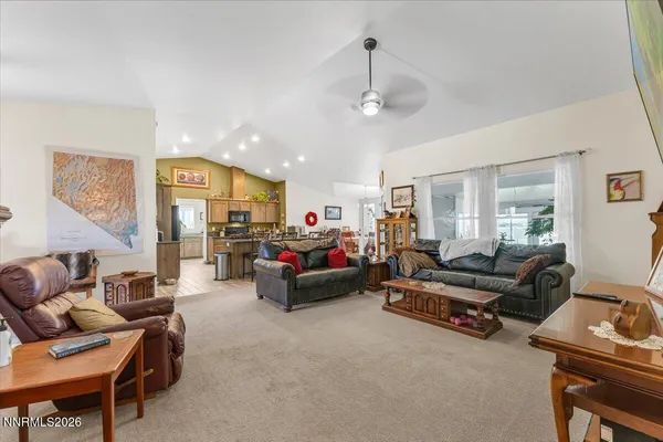 a kitchen with sink cabinets and living room