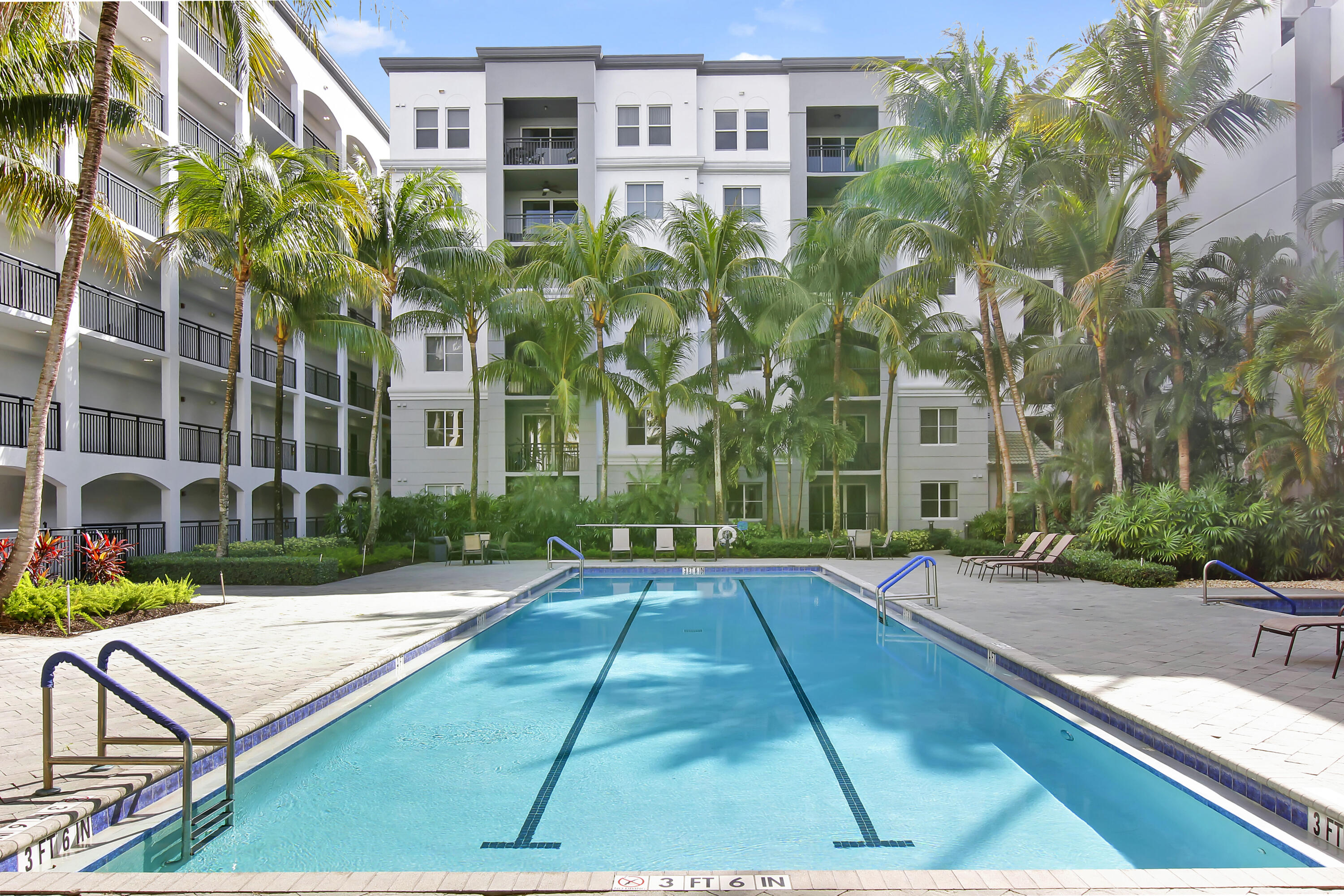 1690 Renaissance Commons Boulevard Boynton Beach, FL 33426 - Photo 15 of 22 a view of a patio with a table and chairs and potted plants