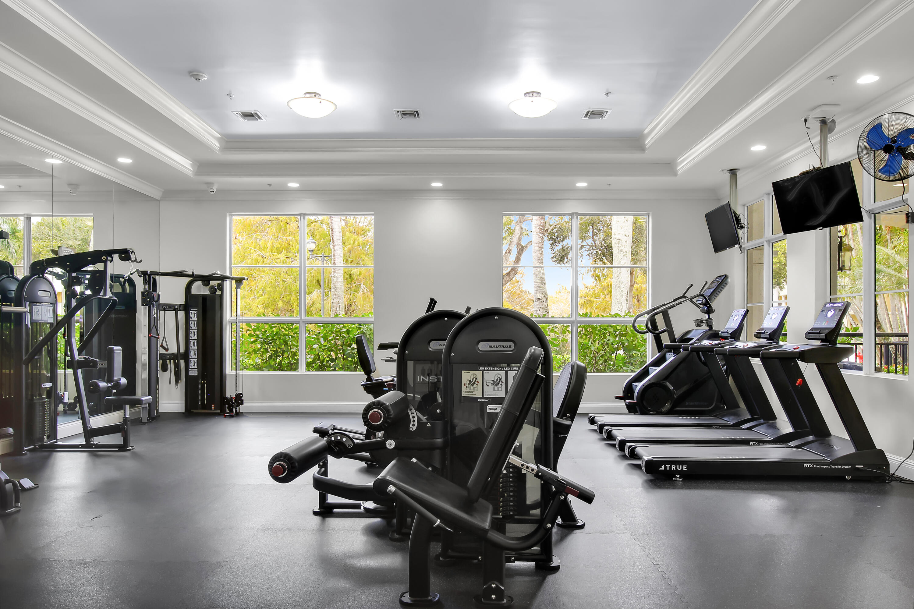 1690 Renaissance Commons Boulevard Boynton Beach, FL 33426 - Photo 18 of 22 a room with gym equipment and a large window