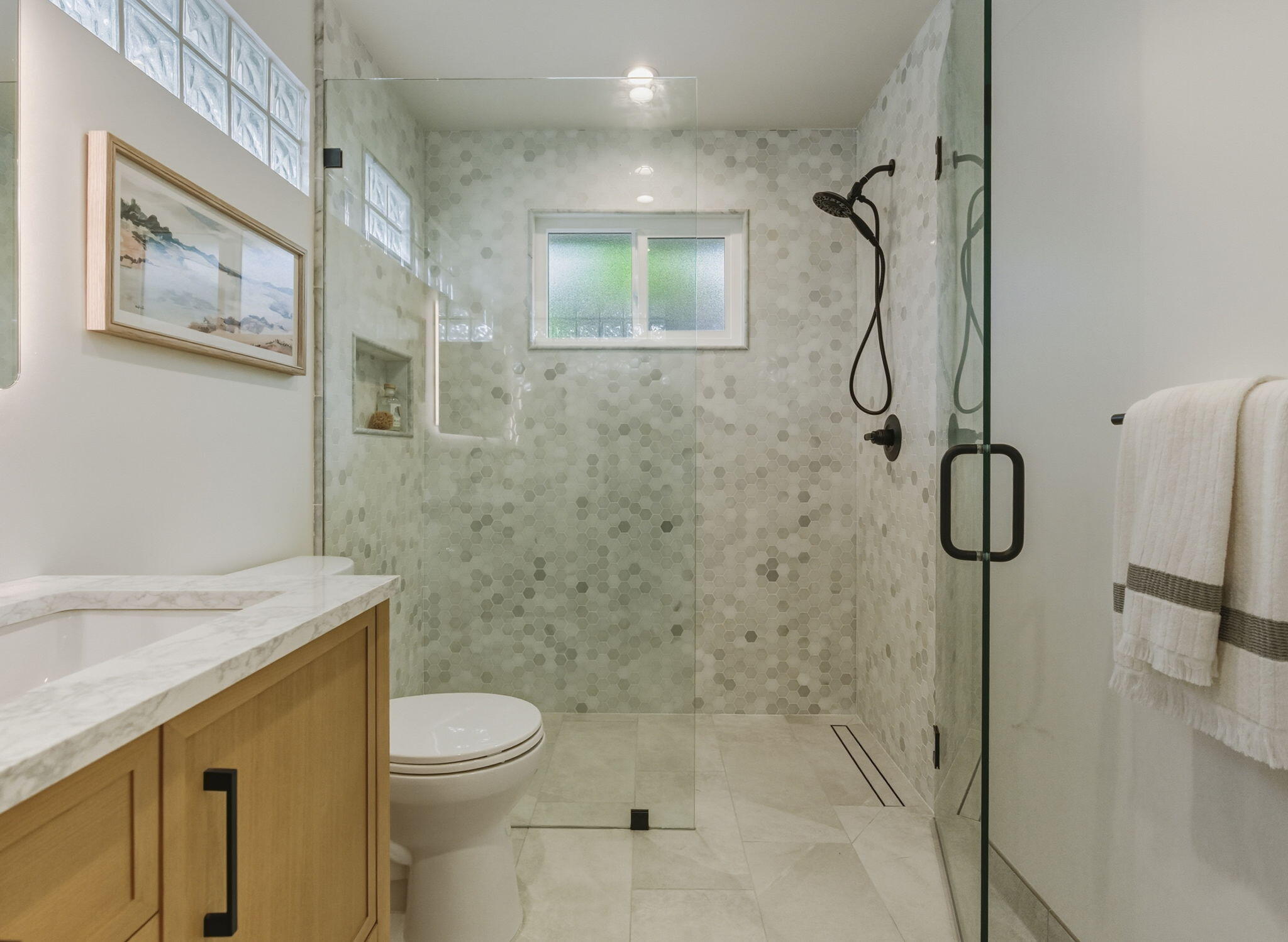 220 Santa Rosa Place Santa Barbara, CA 93109 - Photo 13 of 35 a bathroom with a granite countertop shower a toilet and sink