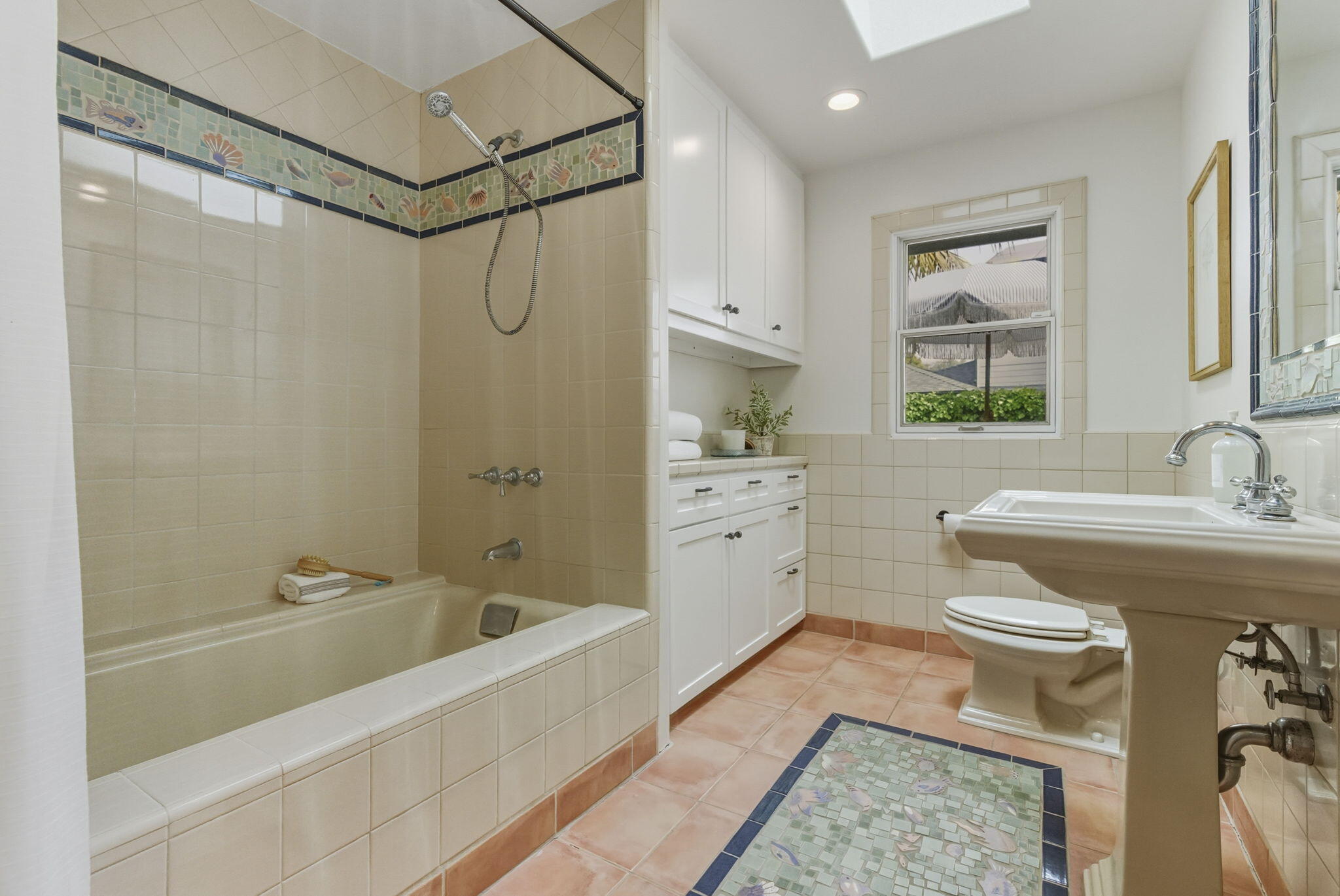 220 Santa Rosa Place Santa Barbara, CA 93109 - Photo 18 of 35 a bathroom with a granite countertop sink a toilet and shower