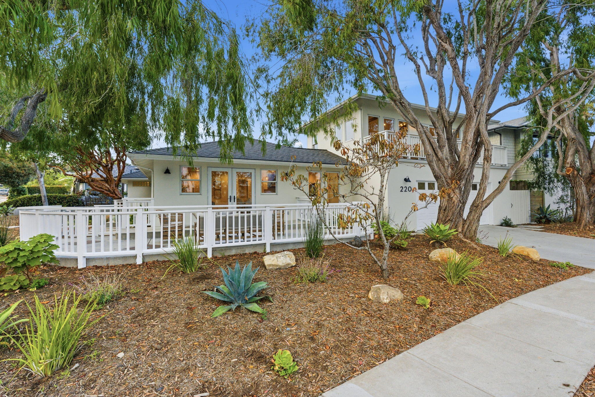 220 Santa Rosa Place Santa Barbara, CA 93109 - Photo 34 of 35 a view of a house with a yard and wooden fence