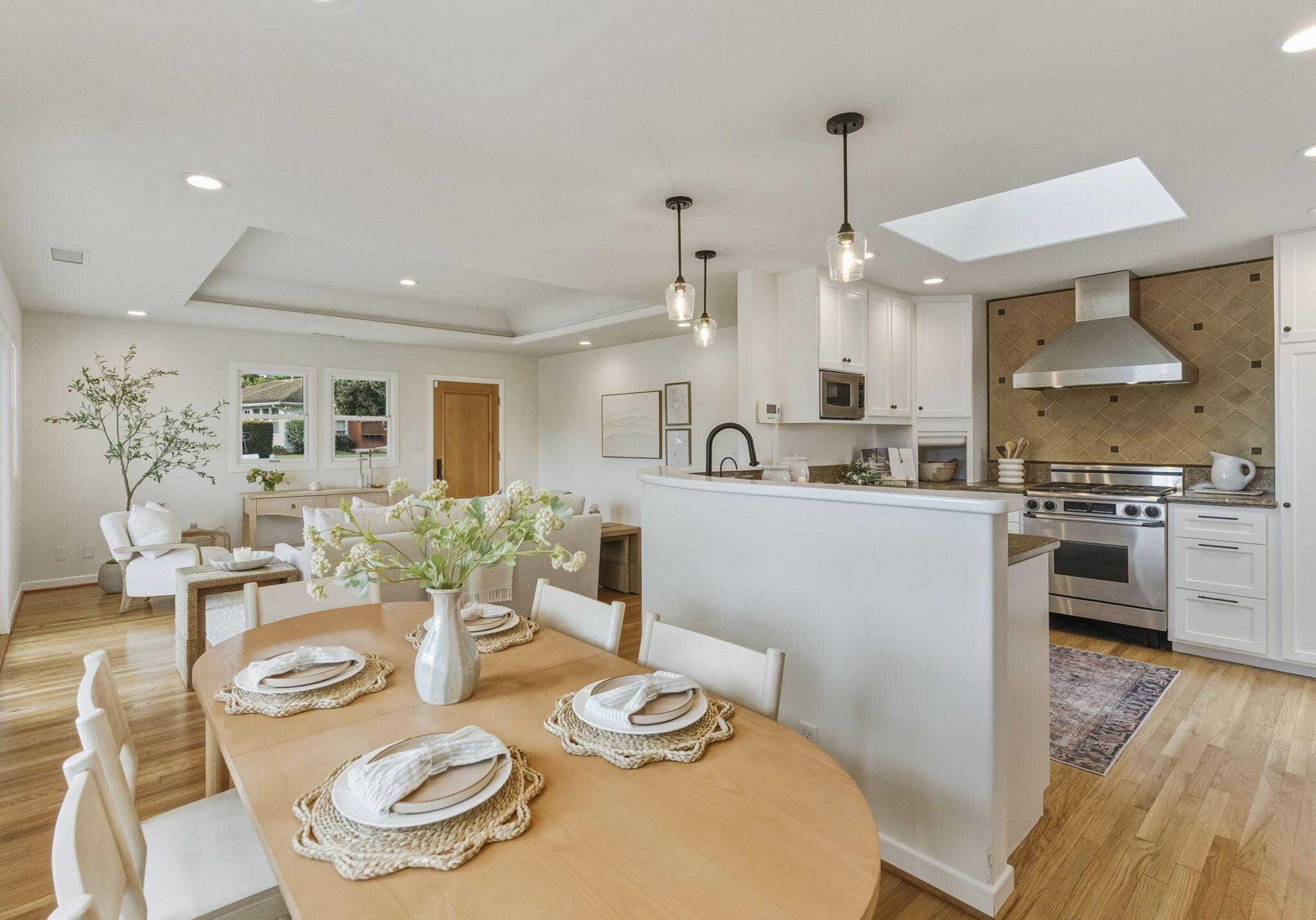 220 Santa Rosa Place Santa Barbara, CA 93109 - Photo 7 of 35 a living room with kitchen island furniture and wooden floor