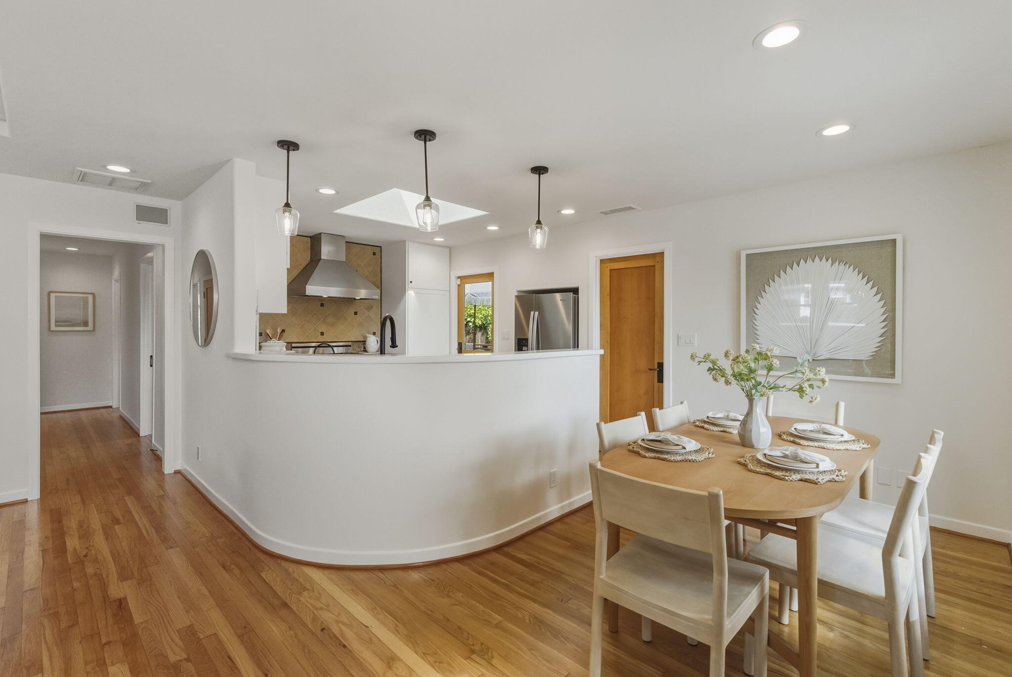 220 Santa Rosa Place Santa Barbara, CA 93109 - Photo 9 of 35 a view of a dining room with furniture and wooden floor