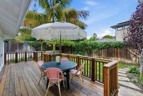 a view of balcony with outdoor seating and wooden floor