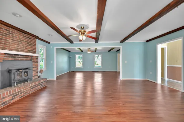 a view of livingroom with hardwood floor and fireplace