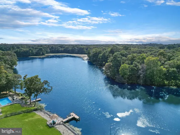 a view of a lake with a yard