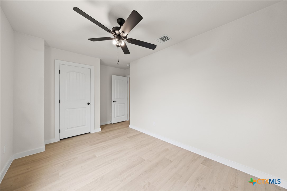 1204 Martin Luther King Jr Lane, Unit B Temple, TX 76504 - Photo 13 of 22 a view of a big room with a ceiling fan