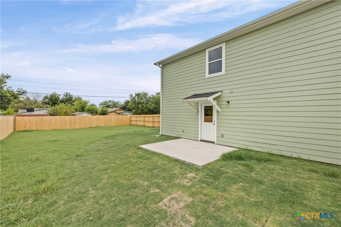 1204 Martin Luther King Jr Lane, Unit B Temple, TX 76504 - Photo 21 of 22 a view of a backyard of the house