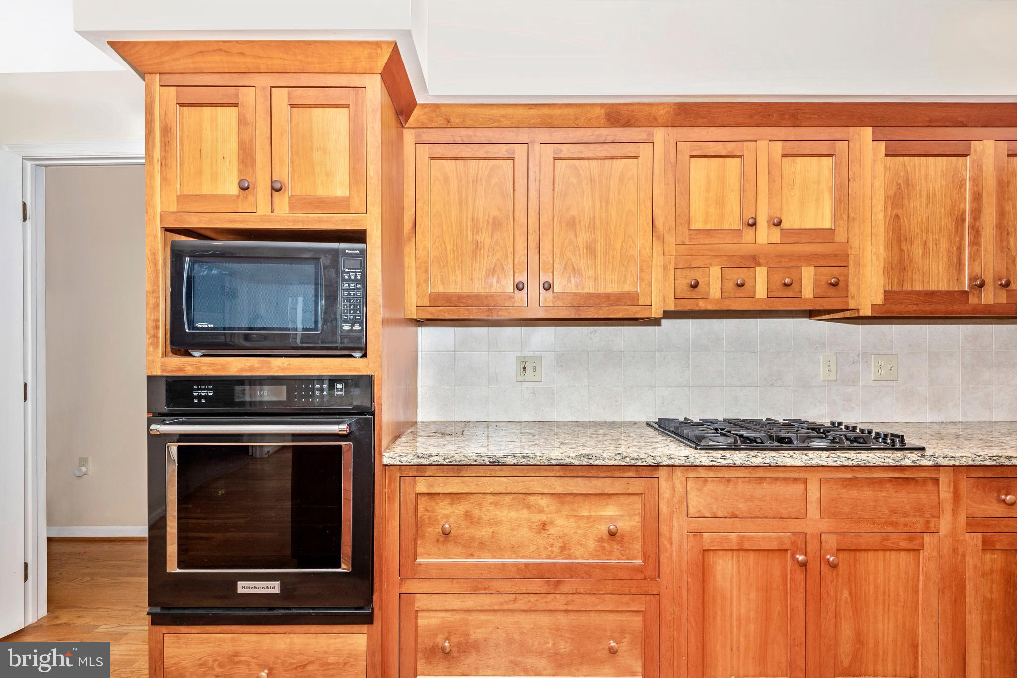 8542 Pete Wiles Road Middletown, MD 21769 - Photo 18 of 77 Cherry cabinetry with a gas cooktop