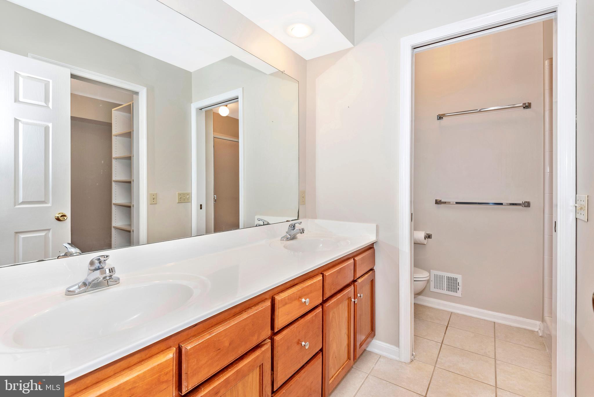 8542 Pete Wiles Road Middletown, MD 21769 - Photo 26 of 77 Main level owner's bath with a double bowl vanity