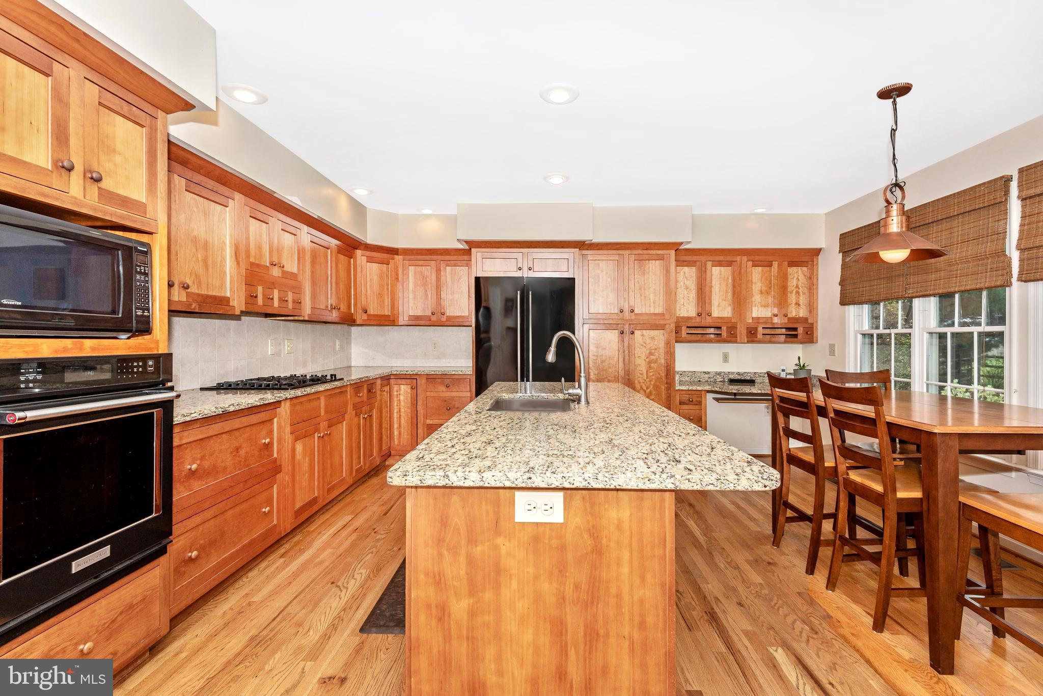 8542 Pete Wiles Road Middletown, MD 21769 - Photo 10 of 77 Cherry cabinetry with granite counter tops