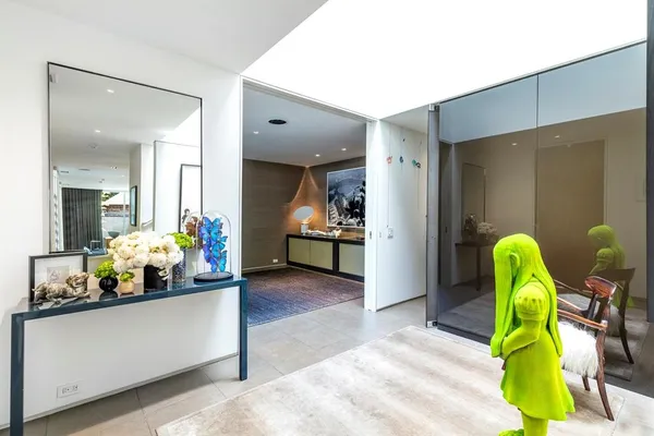 a living room filled with furniture and a chandelier