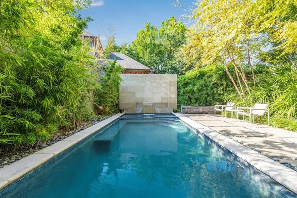 a view of swimming pool with a yard