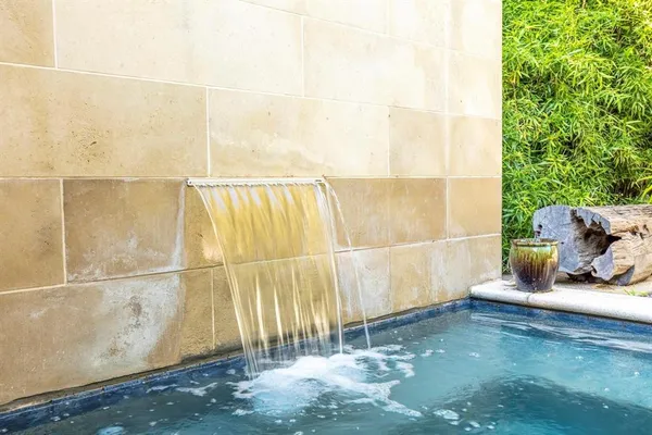 a view of a swimming pool with a patio