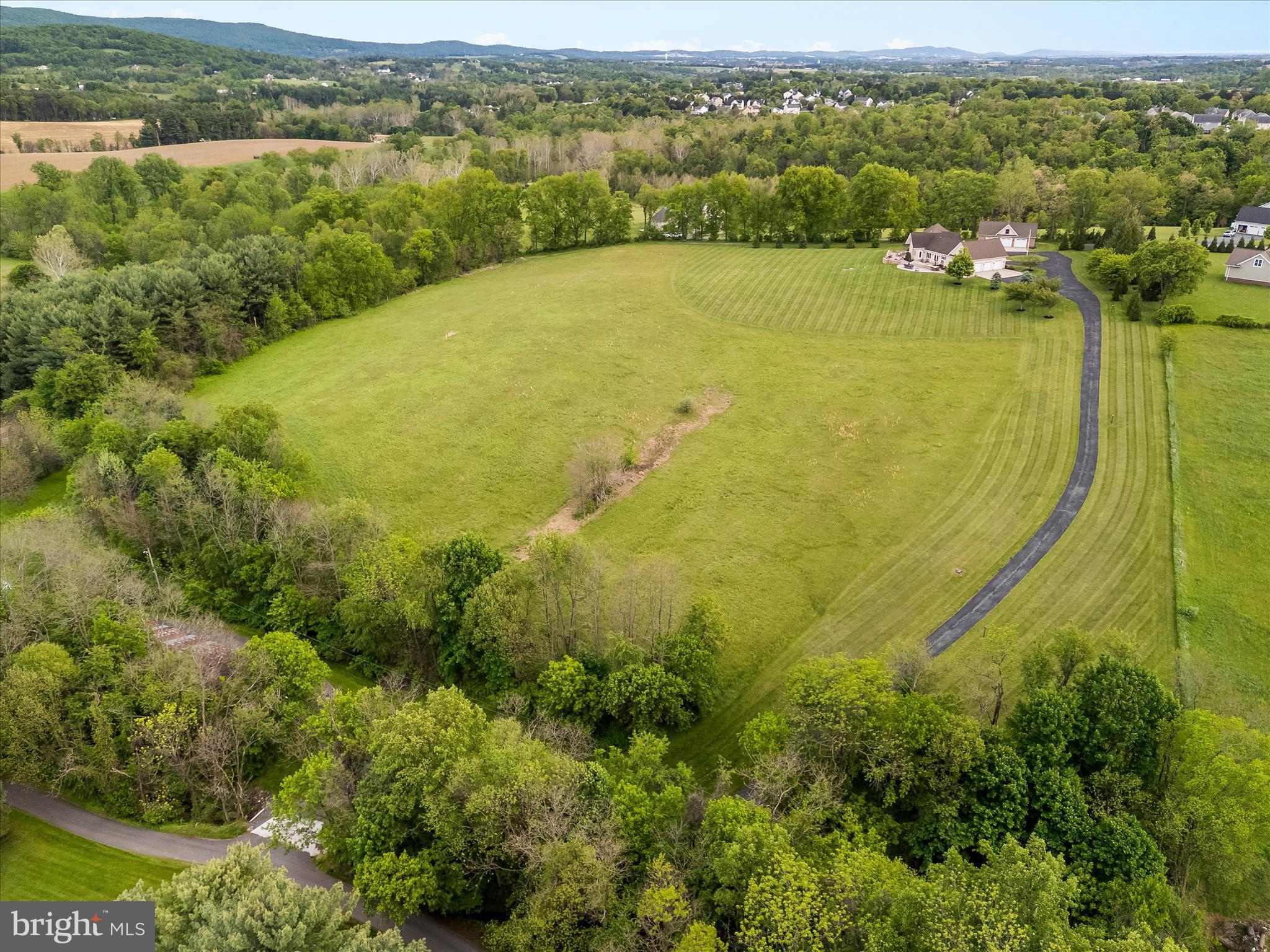10691 Easterday Road Myersville, MD 21773 - Photo 65 of 79 a view of a lake with a mountain in the background