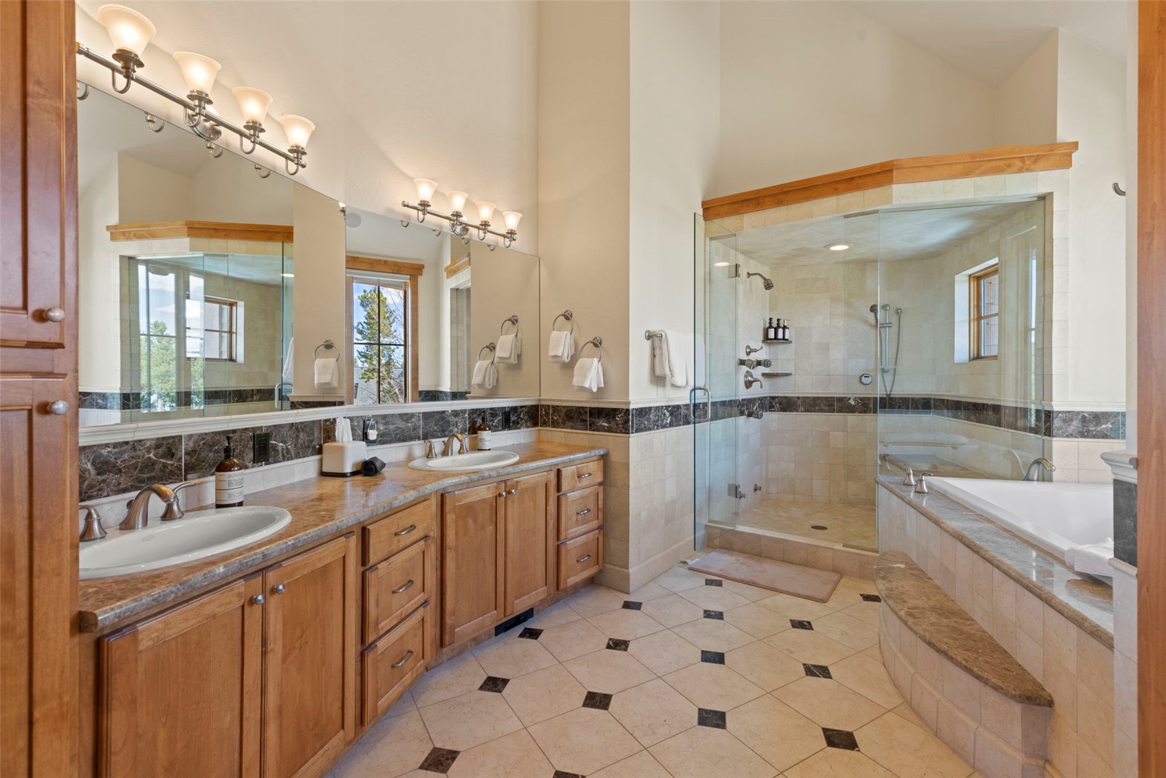 317 Timbertrail Road Breckenridge, CO 80424 - Photo 29 of 50 a large bathroom with a double vanity sink a mirror and a bathtub