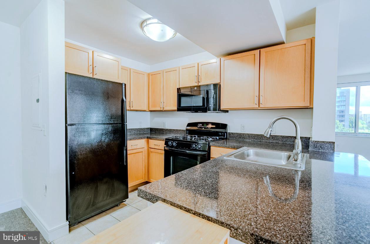 800 4th Street Southwest, Unit S501 Washington, DC 20024 - Photo 2 of 26 a kitchen with stainless steel appliances granite countertop a refrigerator a stove top oven a sink and dishwasher