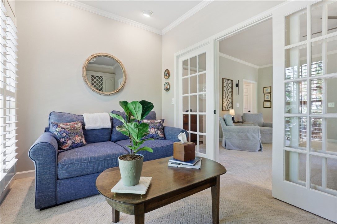 103 5 Knoll Court Anderson, SC 29621 - Photo 6 of 33 French doors and plantation shutters create a tranquil setting in this well-lit living space.