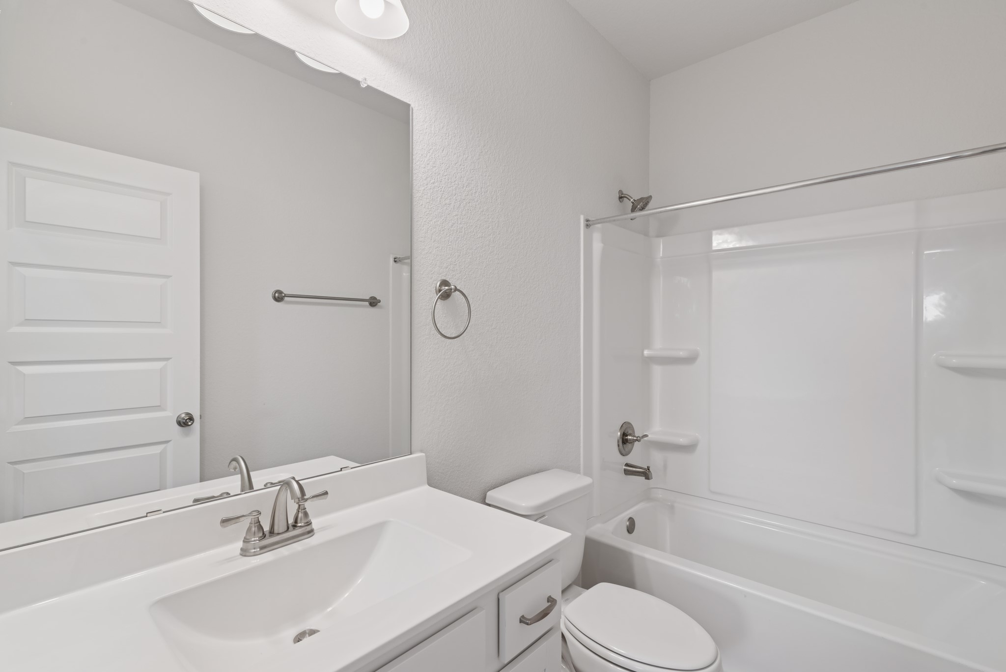 9793 Enclave Ridge Road Willis, TX 77318 - Photo 13 of 20 a bathroom with a sink toilet and shower