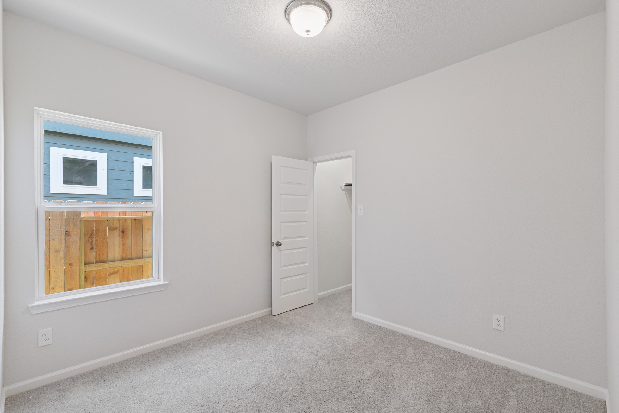9793 Enclave Ridge Road Willis, TX 77318 - Photo 14 of 20 an empty room with windows and closet