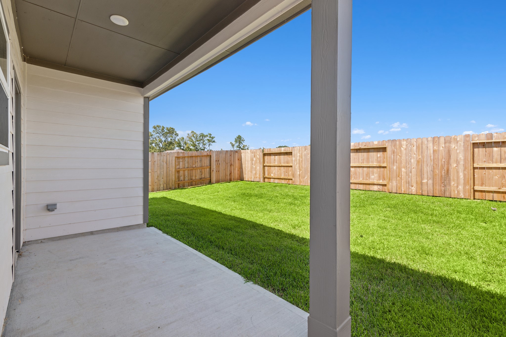 9793 Enclave Ridge Road Willis, TX 77318 - Photo 17 of 20 a view of a backyard with garden