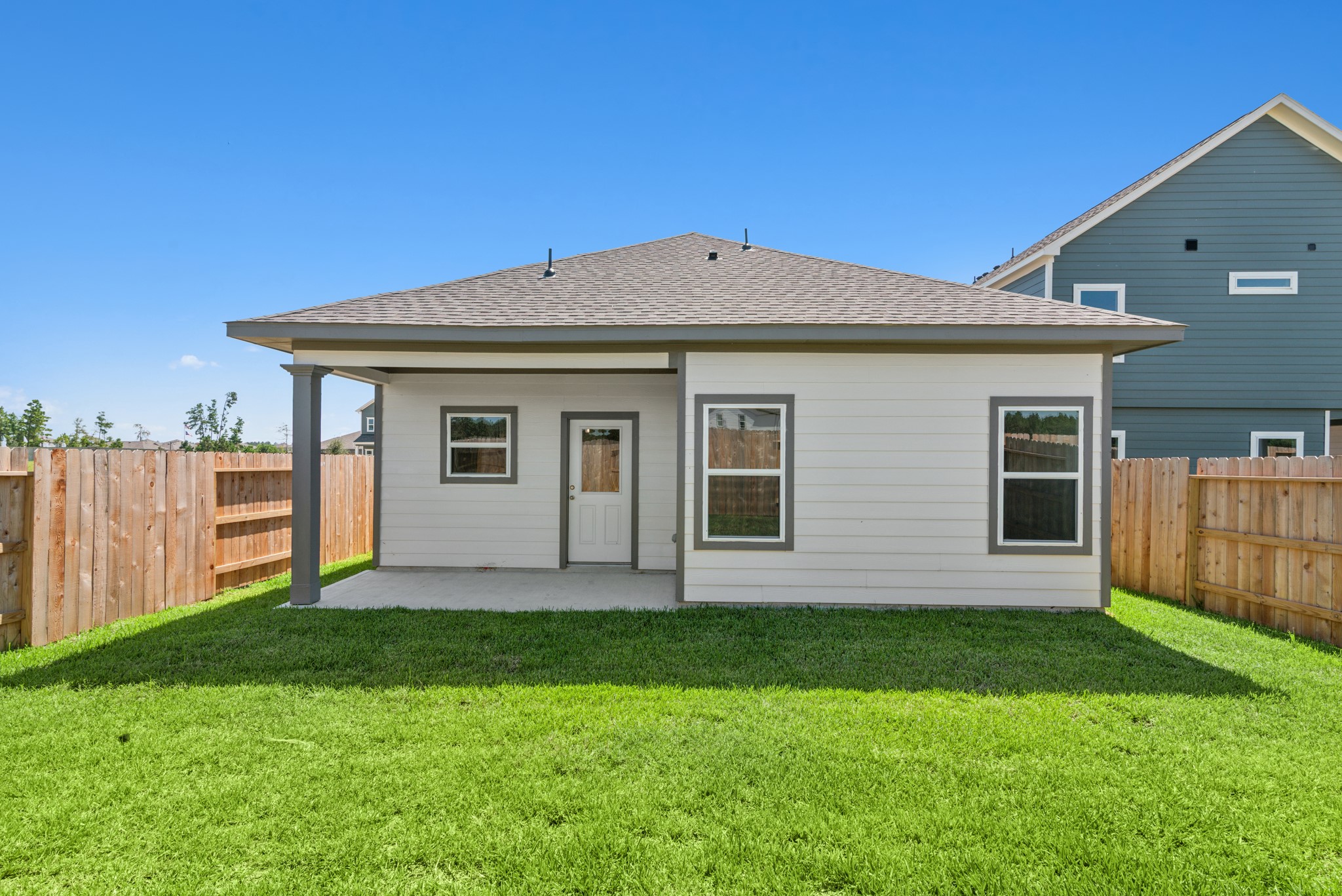 9793 Enclave Ridge Road Willis, TX 77318 - Photo 18 of 20 a front view of house with yard and green space