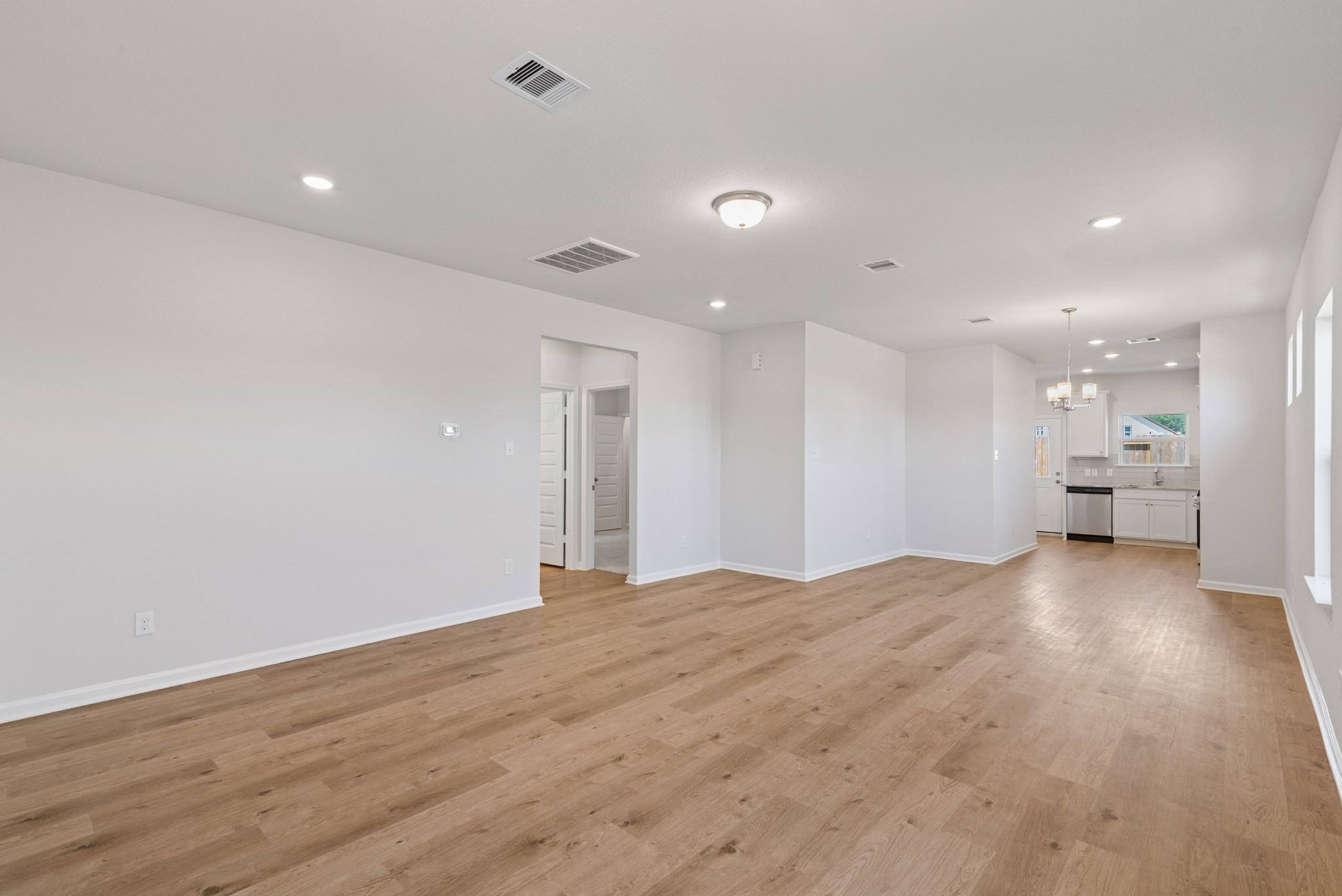 9793 Enclave Ridge Road Willis, TX 77318 - Photo 3 of 20 a view of an empty room with wooden floor