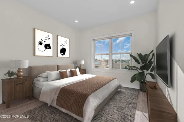 a bedroom with bed mirror and window