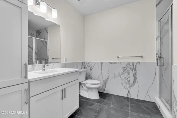 a bathroom with a sink toilet and vanity