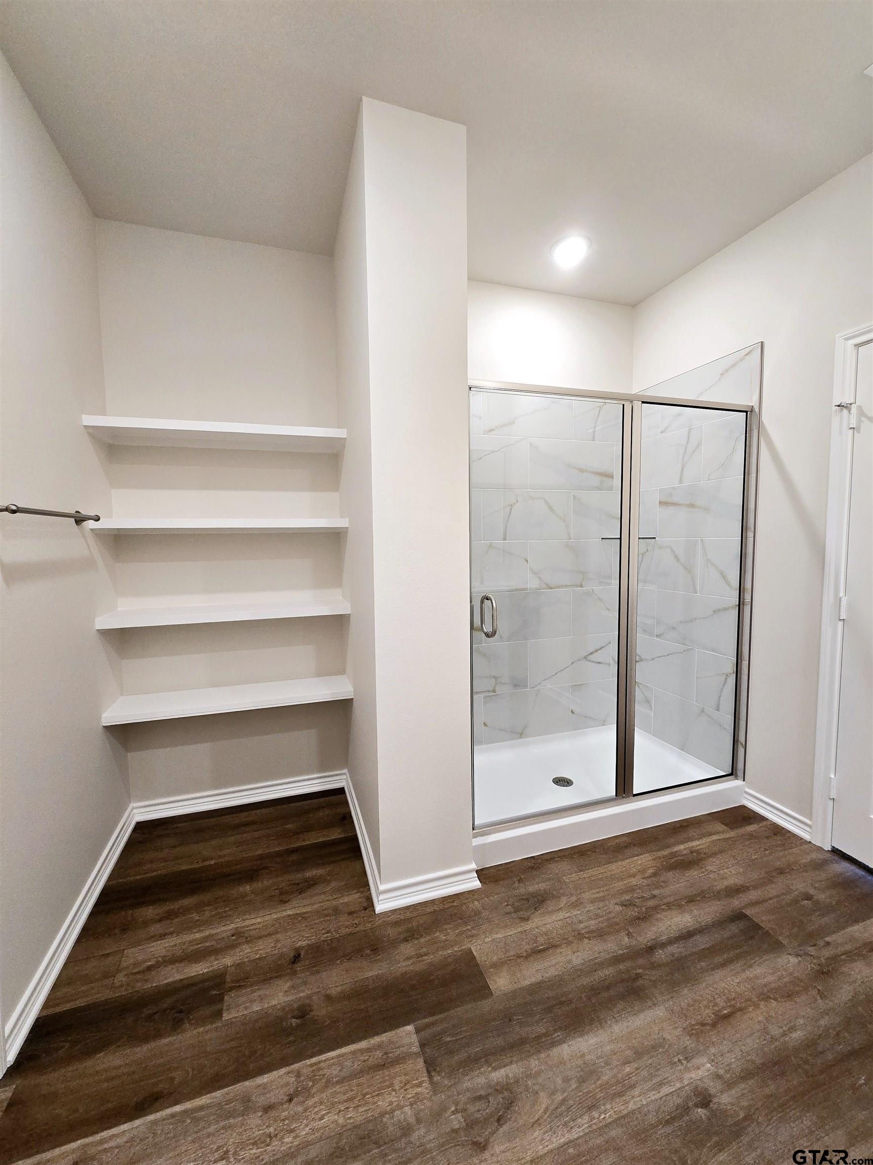 602 Kidd Drive Chandler, TX 75758 - Photo 14 of 22 a view of a room with wooden floor and white walls