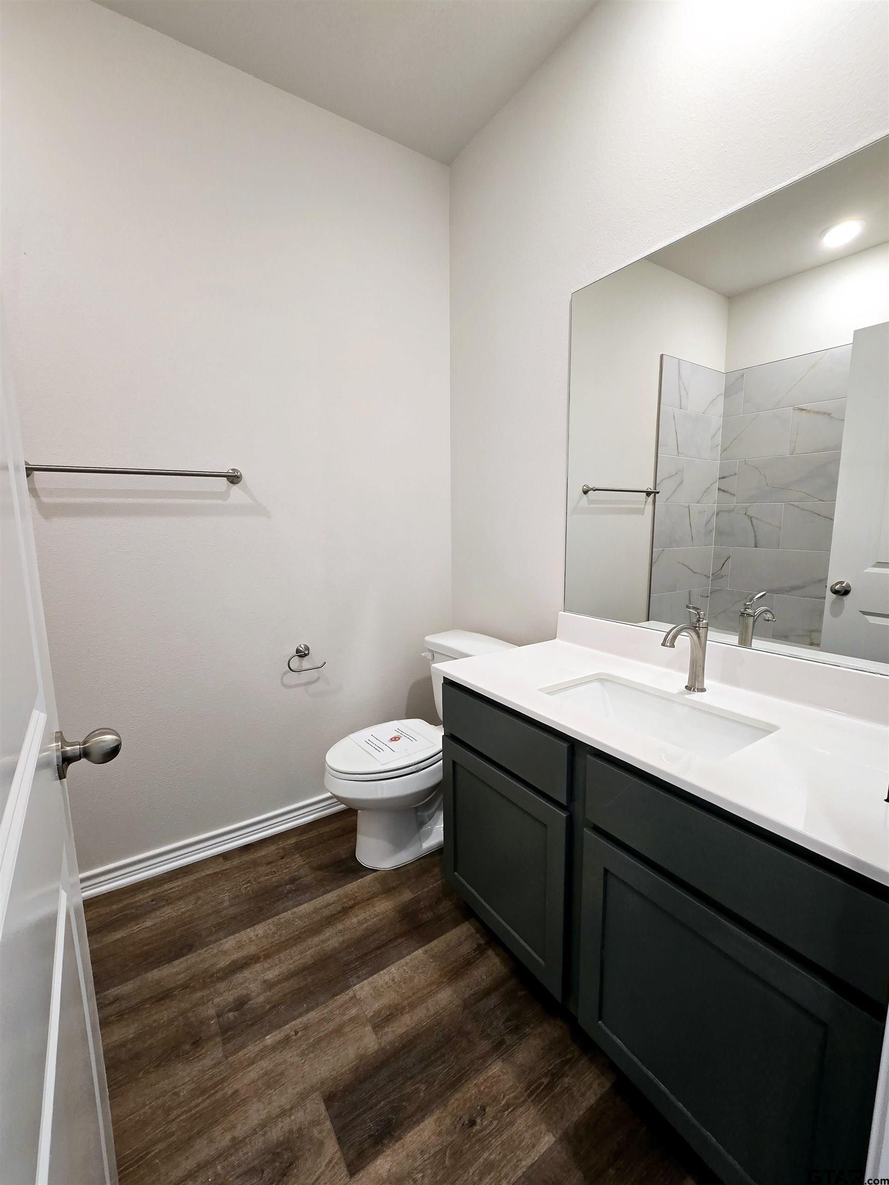 602 Kidd Drive Chandler, TX 75758 - Photo 18 of 22 a bathroom with a sink and a toilet