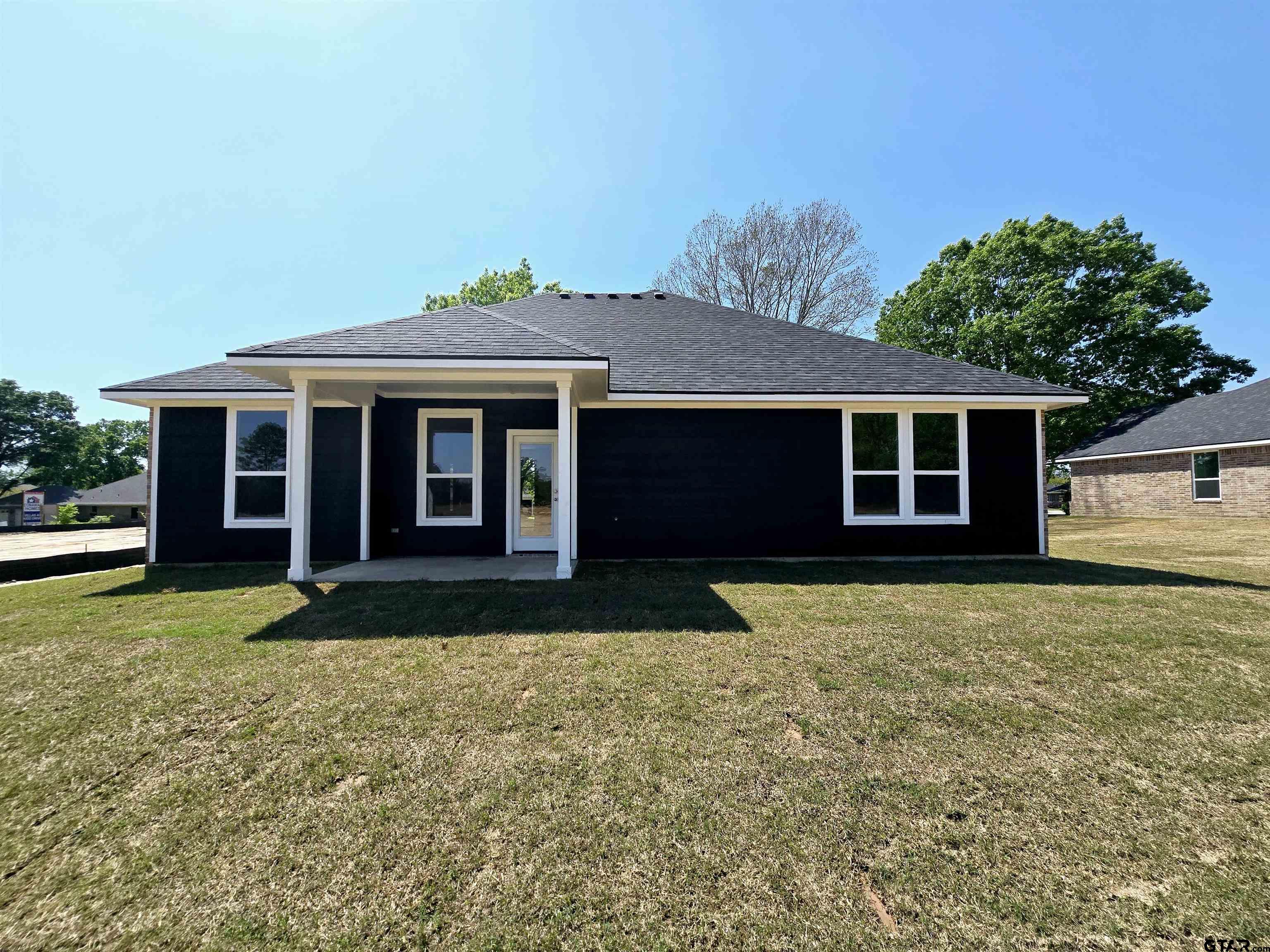 602 Kidd Drive Chandler, TX 75758 - Photo 19 of 22 a front view of a house with a garden