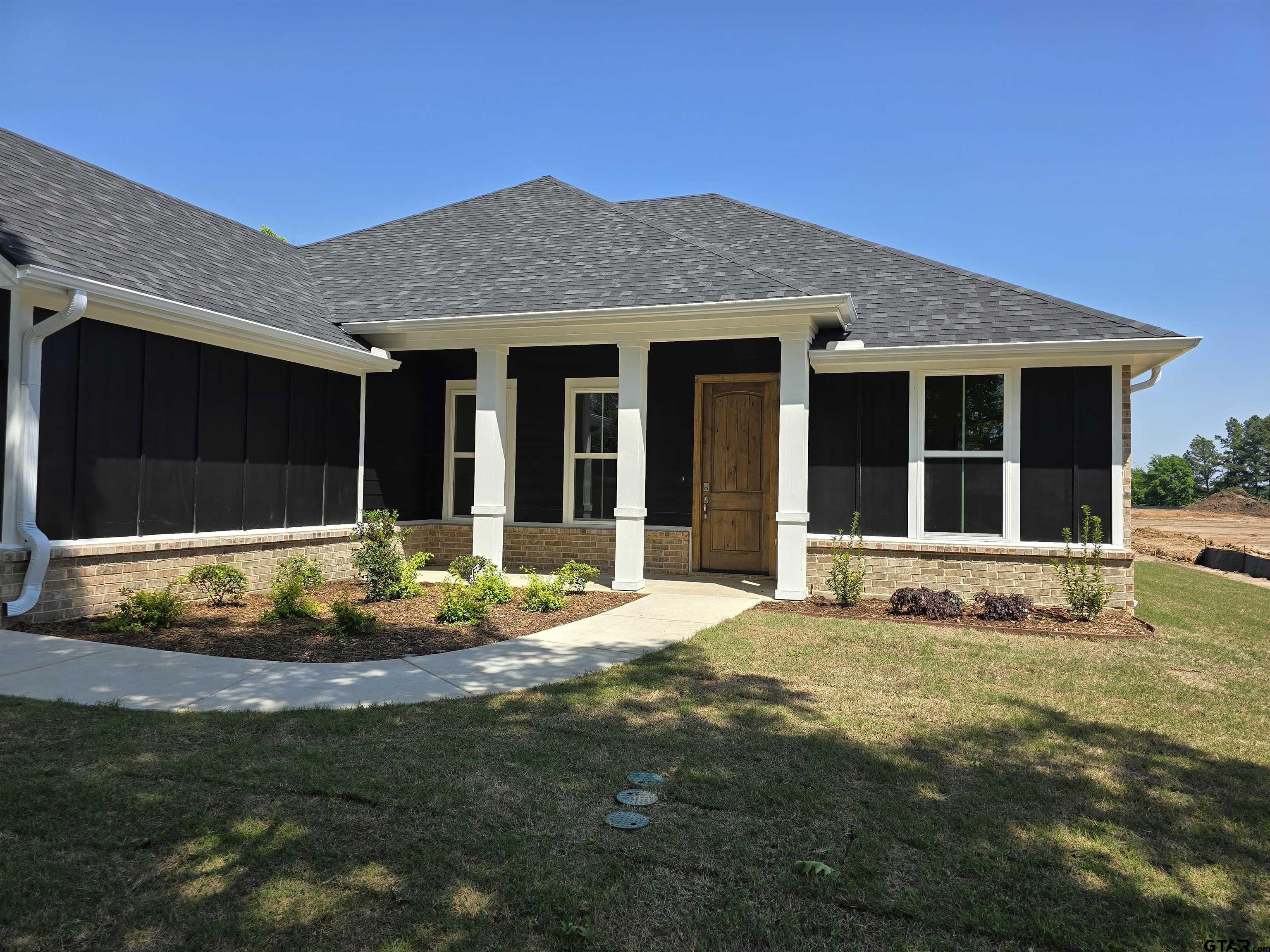 602 Kidd Drive Chandler, TX 75758 - Photo 22 of 22 a front view of a house with a yard