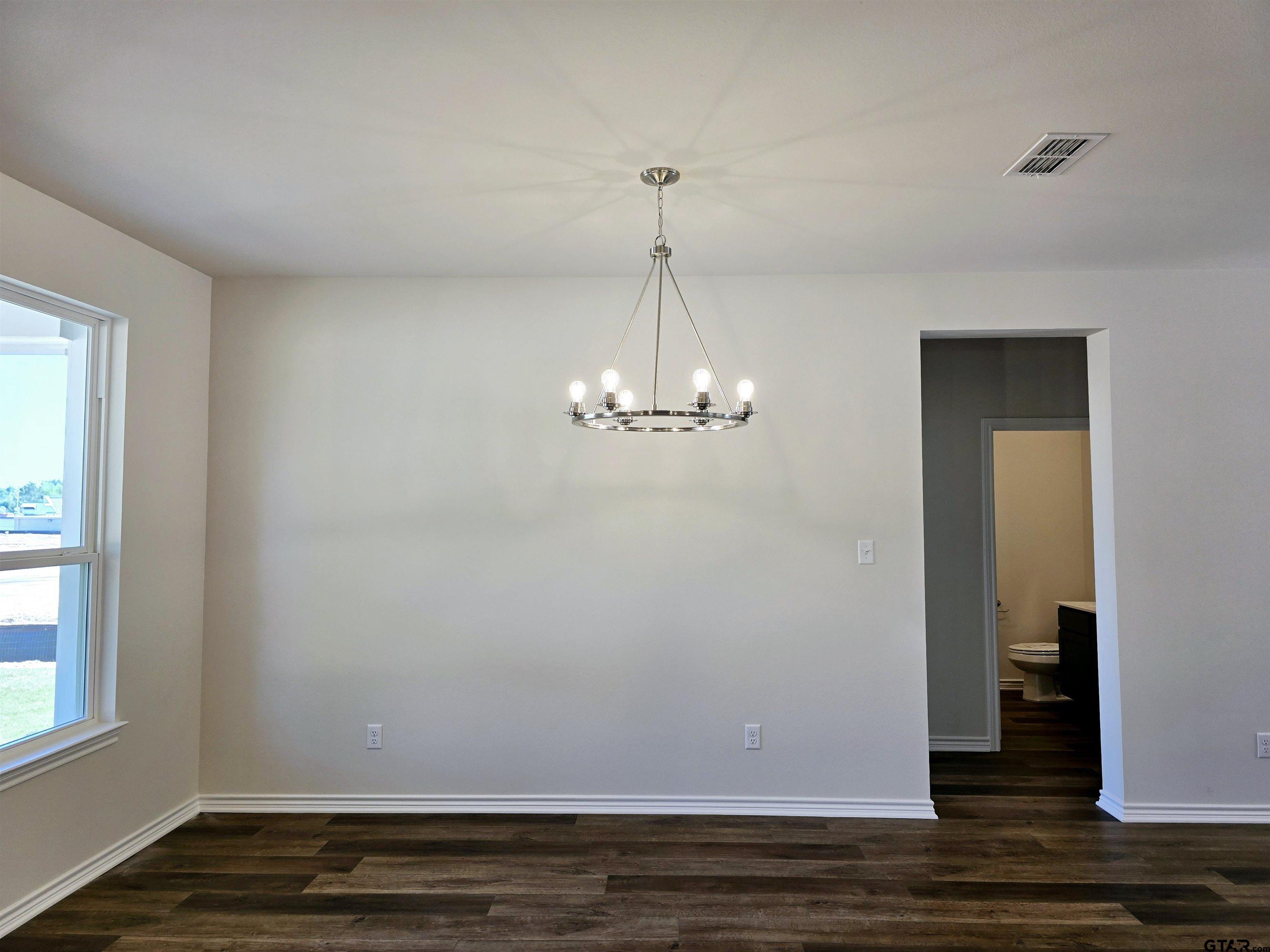 602 Kidd Drive Chandler, TX 75758 - Photo 7 of 22 a view of a room with wooden floor and staircase