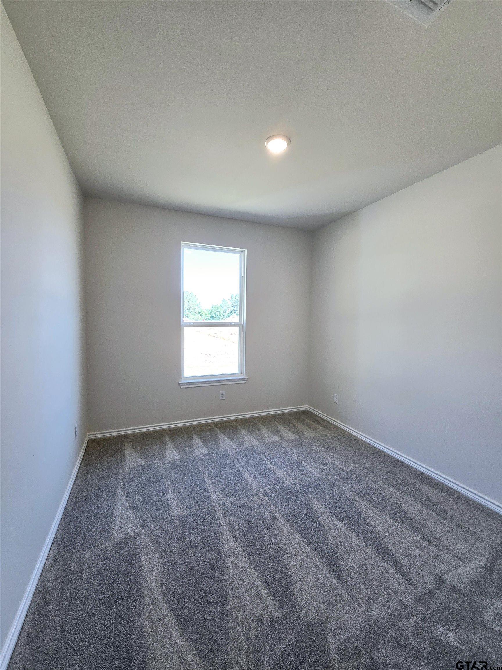 602 Kidd Drive Chandler, TX 75758 - Photo 8 of 22 an empty room with a window