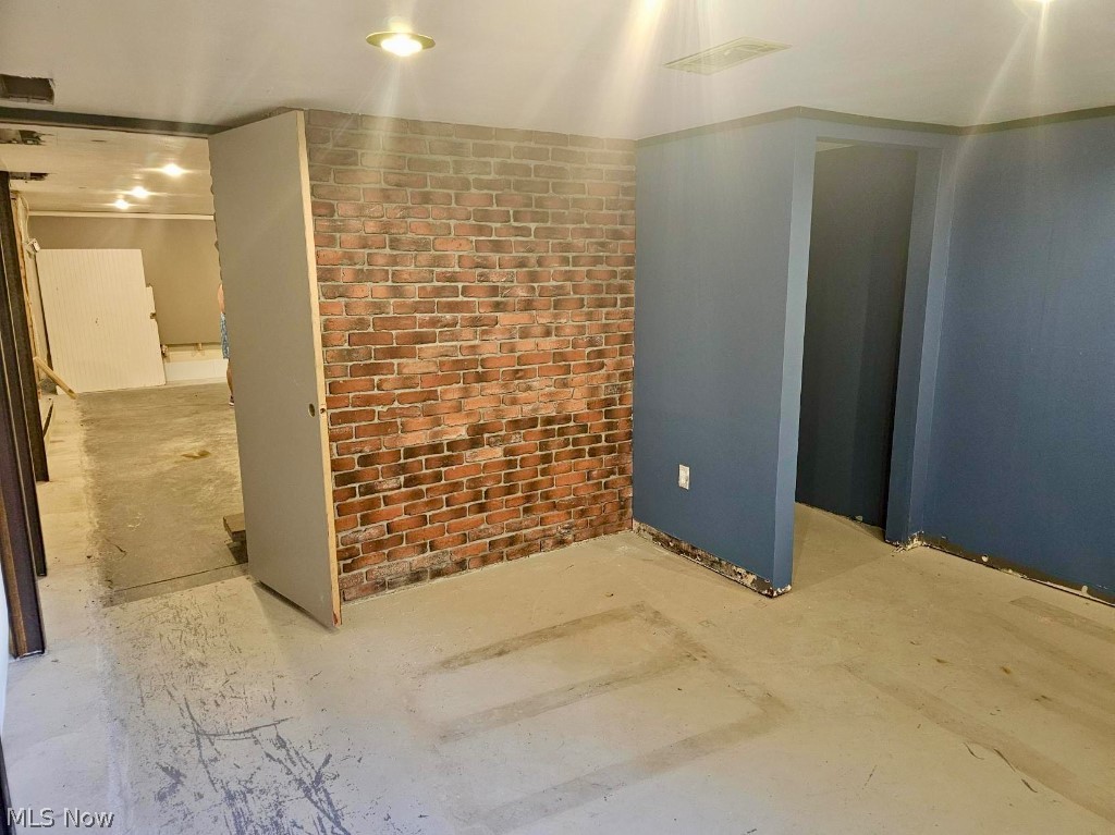 7735 Ragall Parkway Cleveland, OH 44130 - Photo 28 of 32 Spare room with brick wall