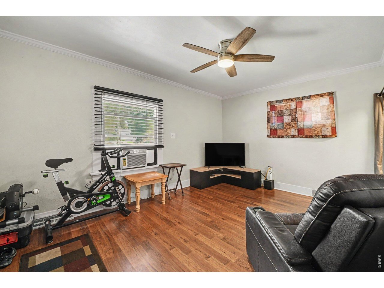 427 9th Street Greeley, CO 80631 - Photo 5 of 22 a living room with furniture and a flat screen tv