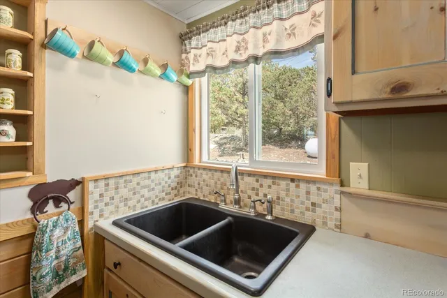 a bathroom with a sink and a large mirror